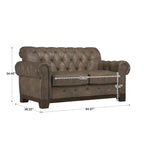 Gecapitonneerde Chesterfield loveseat met gerolde armleuningen en nagelkopaccenten