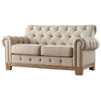 Gecapitonneerde Chesterfield loveseat met gerolde armleuningen en nagelkopaccenten