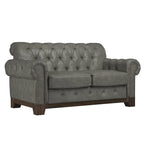 Gecapitonneerde Chesterfield loveseat met gerolde armleuningen en nagelkopaccenten
