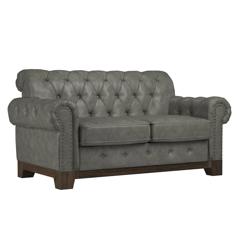 Gecapitonneerde Chesterfield loveseat met gerolde armleuningen en nagelkopaccenten
