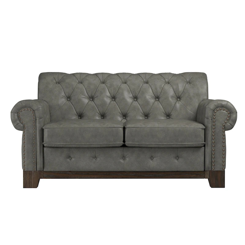 Gecapitonneerde Chesterfield loveseat met gerolde armleuningen en nagelkopaccenten