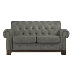 Gecapitonneerde Chesterfield loveseat met gerolde armleuningen en nagelkopaccenten